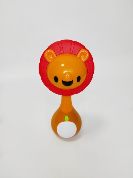 Погремушка музыкальная Hola Toys "Лев" с грызунком и подсветкой 3134C фото